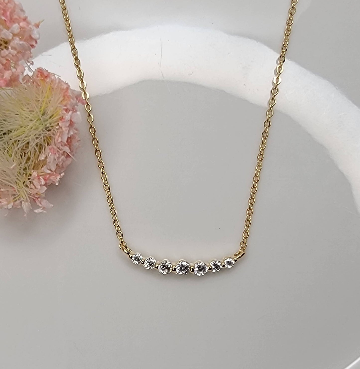 CZ SMALL CURVED BAR NECKLACE.